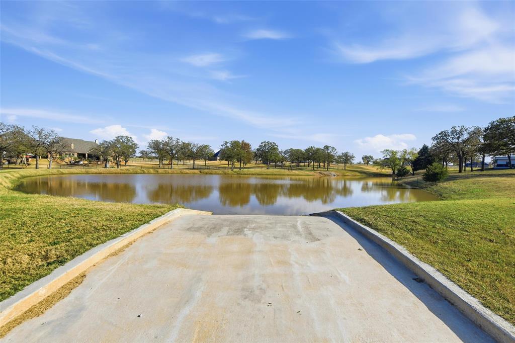 154 Rio Rancho Drive Decatur, TX 76234 - Photo 10 of 16 a view of a lake with houses in the back