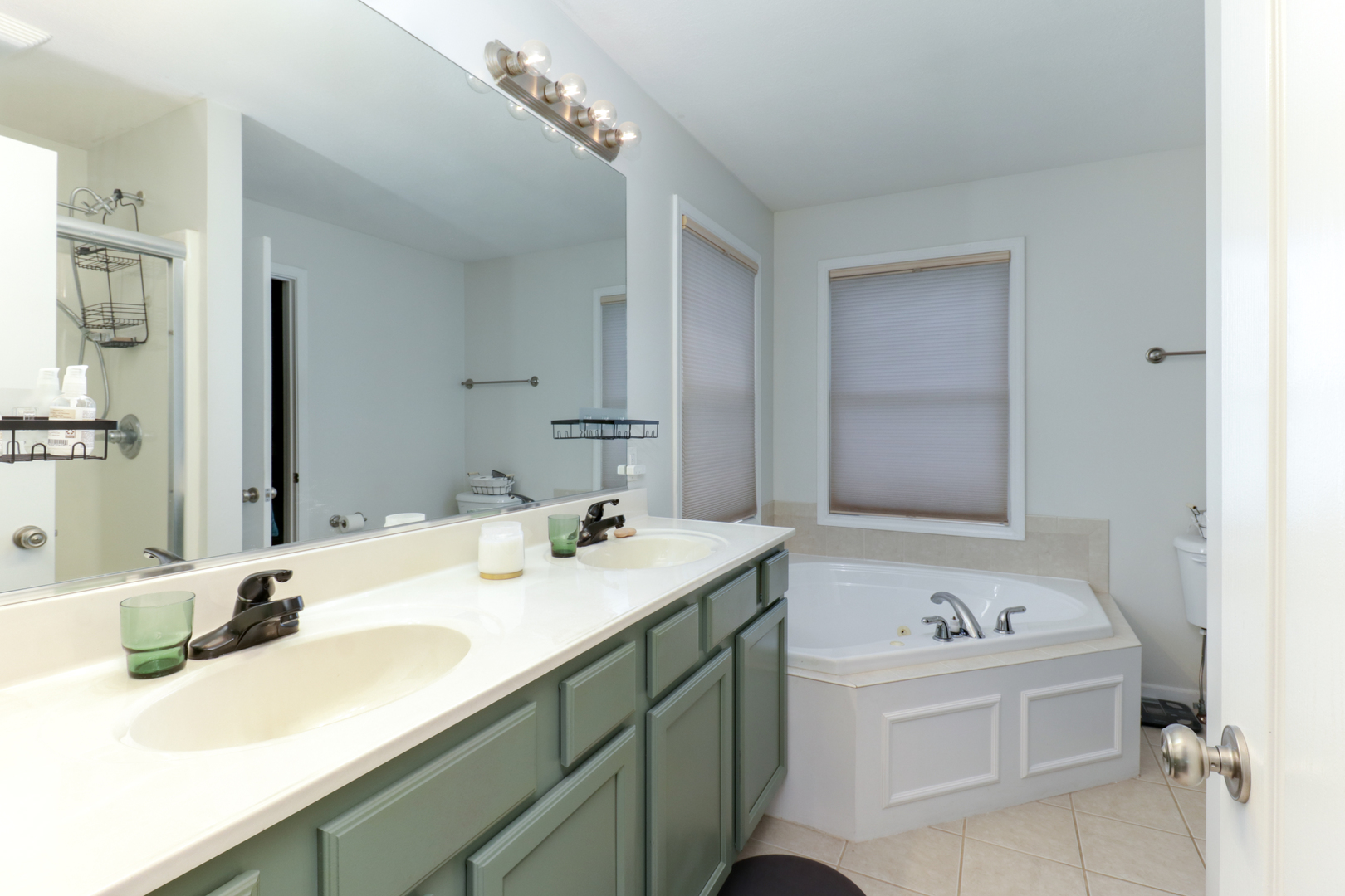 3283 Marimarsh Lane Normal, IL 61761 - Photo 15 of 28 a bathroom with a sink and a mirror