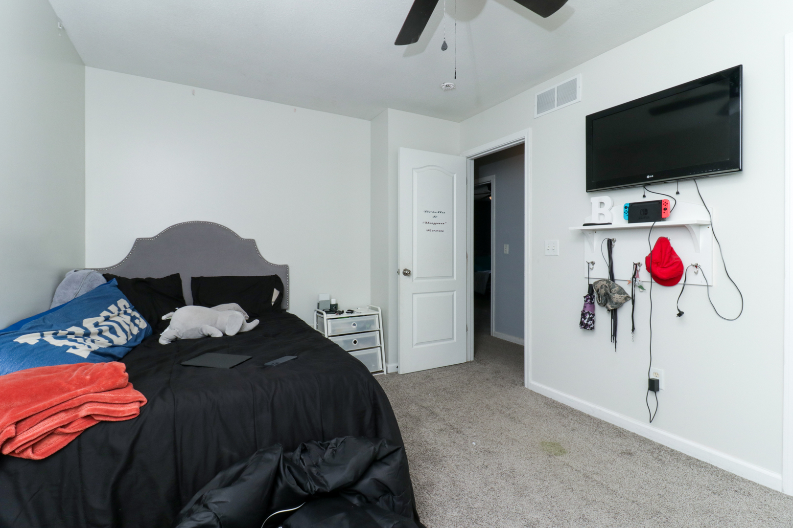 3283 Marimarsh Lane Normal, IL 61761 - Photo 19 of 28 a bedroom with a bed and a flat screen tv