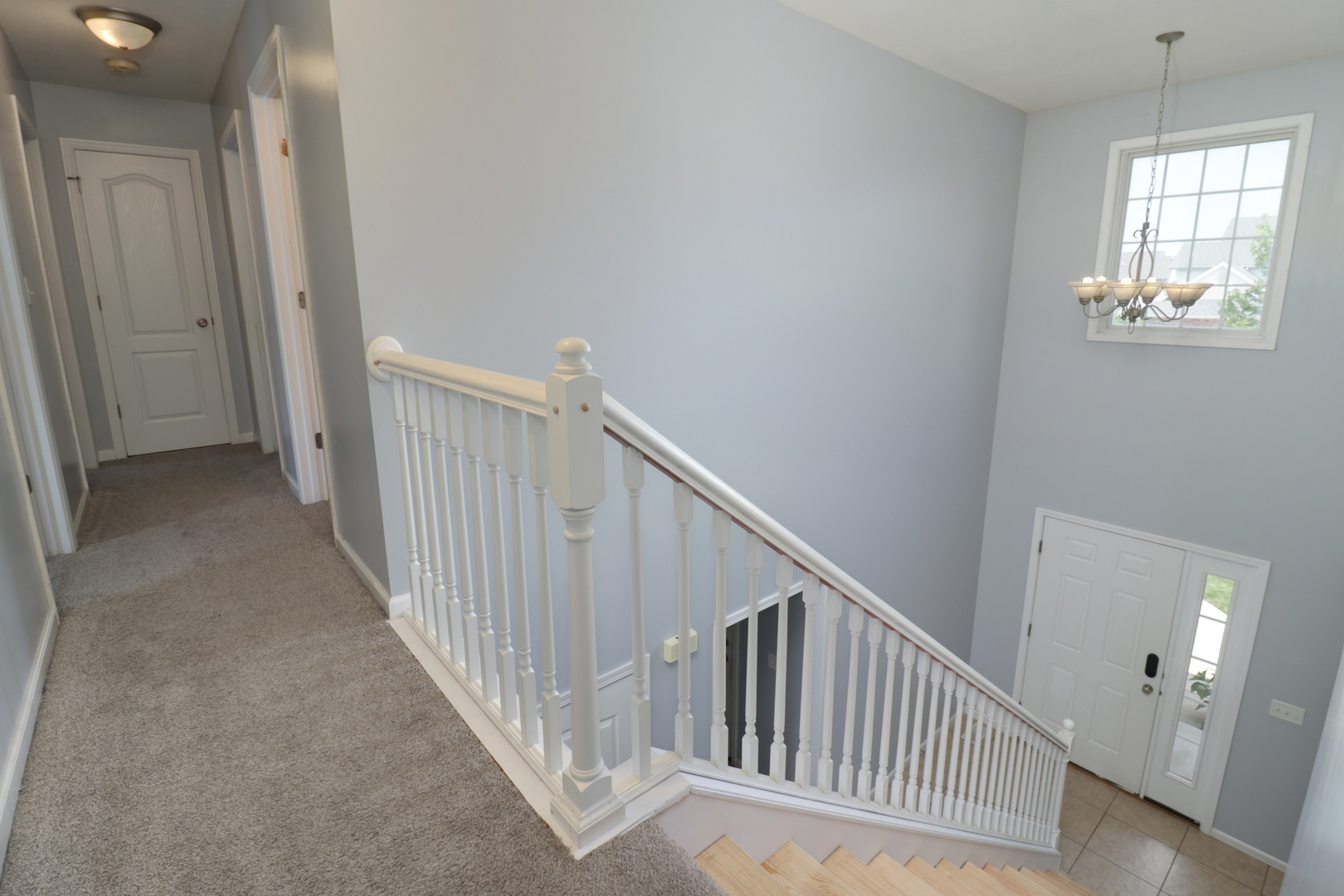 3283 Marimarsh Lane Normal, IL 61761 - Photo 23 of 28 a view of a hallway to window and stairs