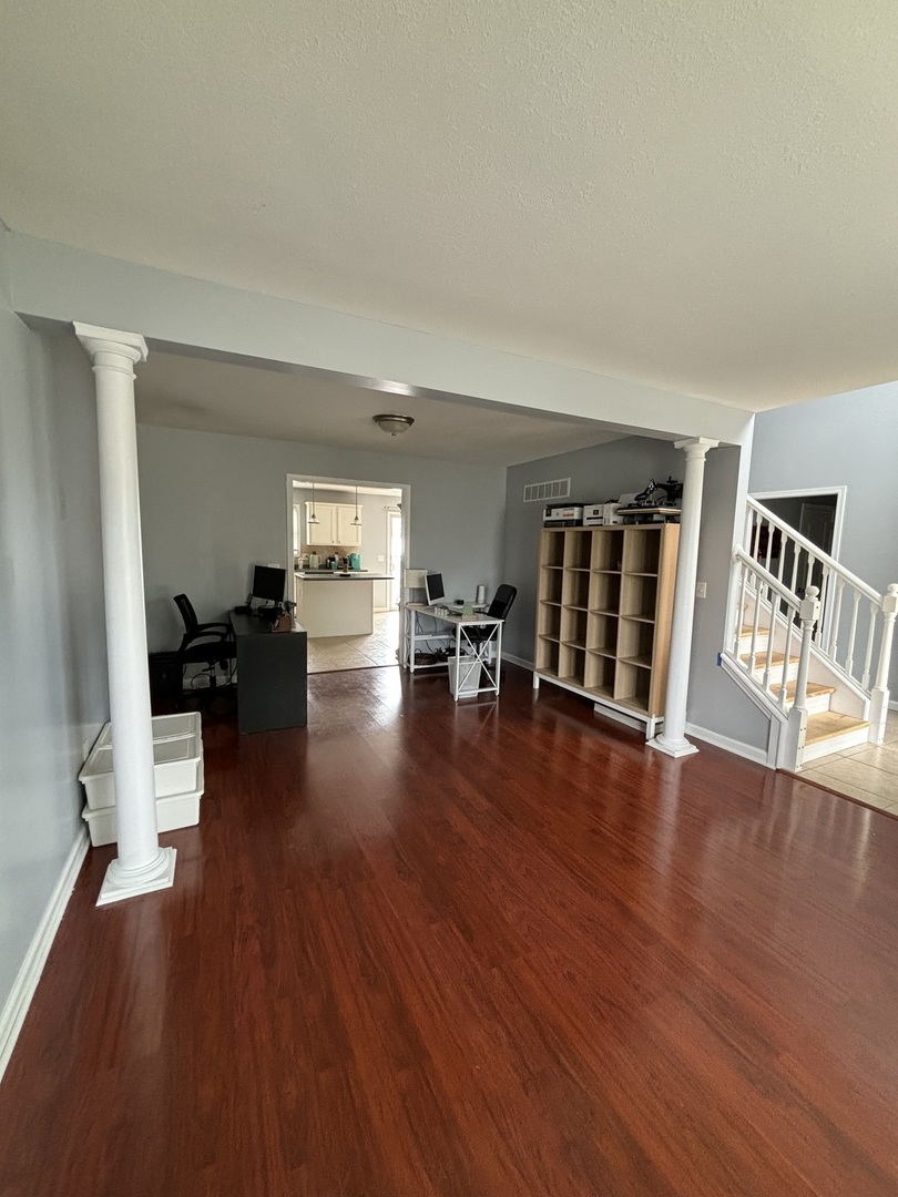 3283 Marimarsh Lane Normal, IL 61761 - Photo 9 of 28 a living room with furniture and a wooden floor