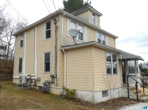 a view of house with a patio
