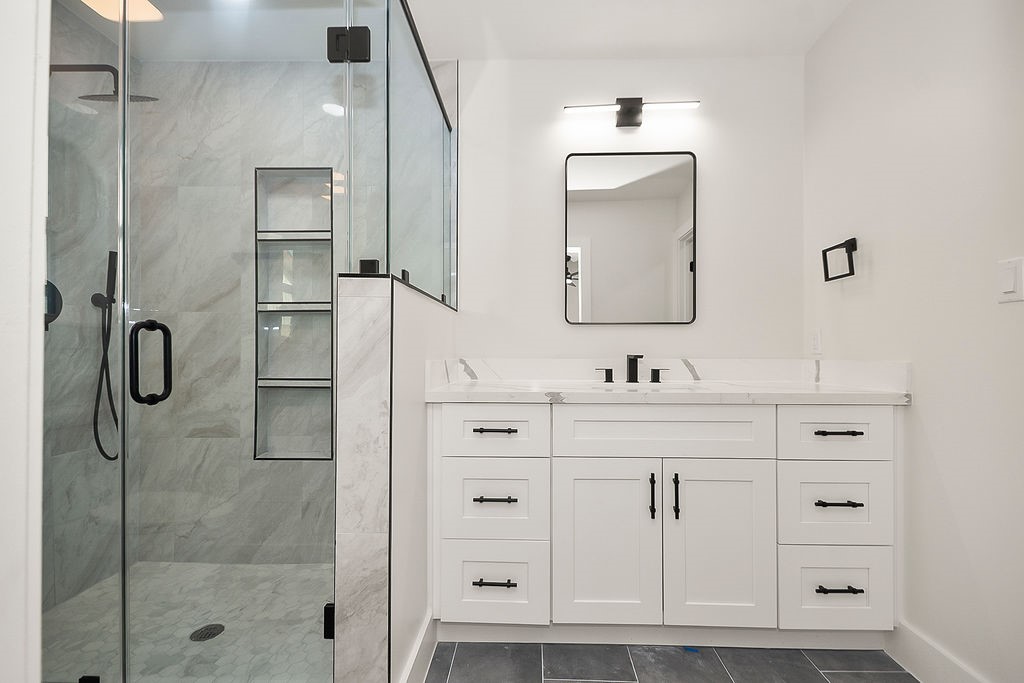 6106 Rutherglenn Drive Houston, TX 77096 - Photo 25 of 41 Another view of the stylishly renovated bathroom with designer finishes throughout.