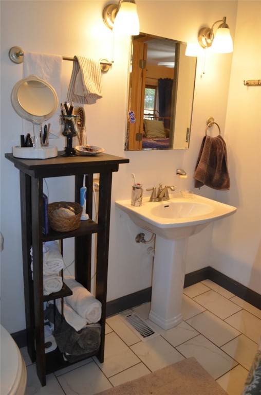 137 Blue Jay Road Central, SC 29630 - Photo 22 of 43 Master Bathroom with new sink, flooring, and fixtu