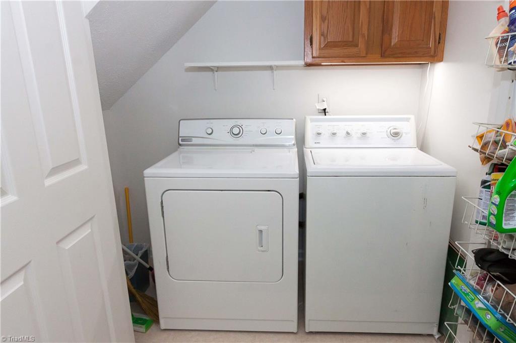 3102 Spring Mill Road Greensboro, NC 27406 - Photo 12 of 27 Laundry room is located on main floor, just off powder room.