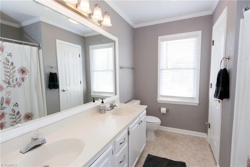 3102 Spring Mill Road Greensboro, NC 27406 - Photo 14 of 27 Pretty master bath features double vanities and fresh paint!