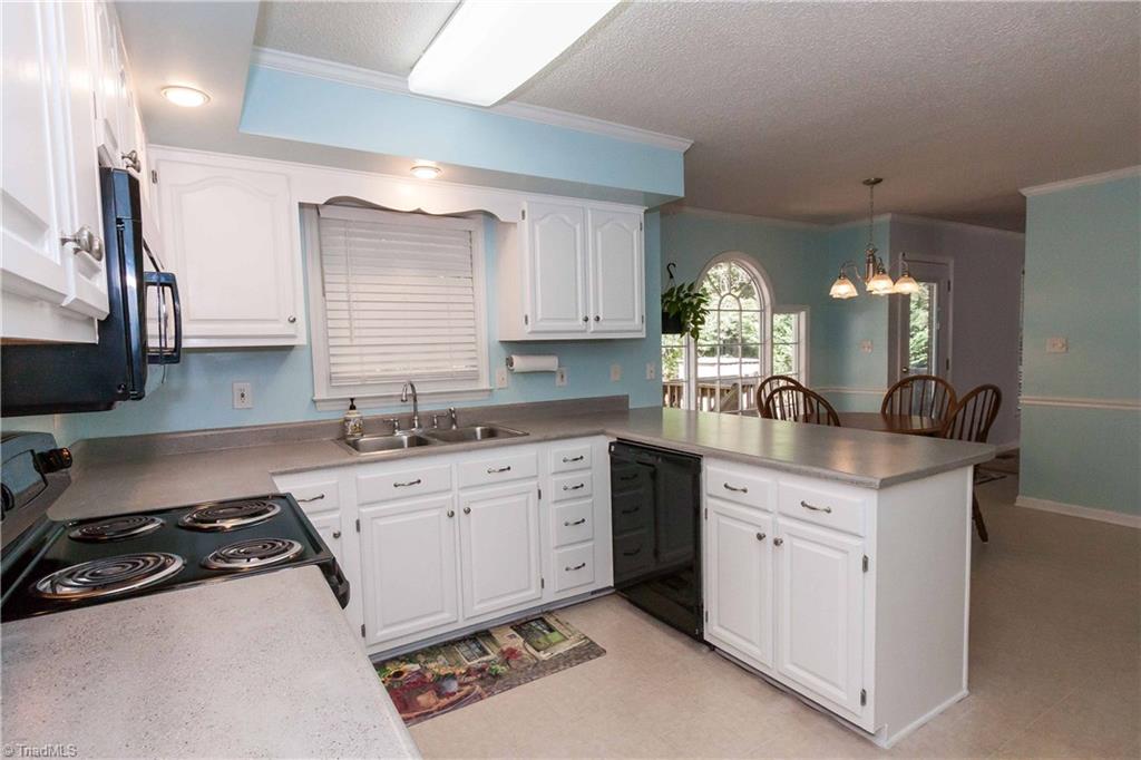 3102 Spring Mill Road Greensboro, NC 27406 - Photo 7 of 27 Good counter space and storage satisfies even the most finicky home chefs!