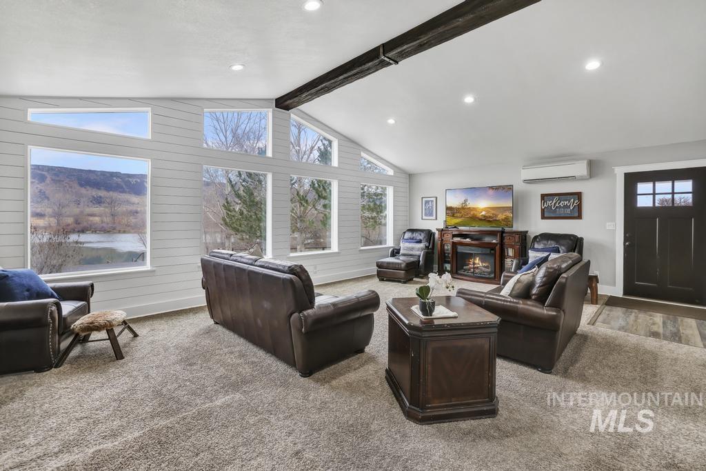 1785 River Road Buhl, ID 83316 - Photo 14 of 41 Living room with carpet flooring, an AC wall unit, and recessed lighting