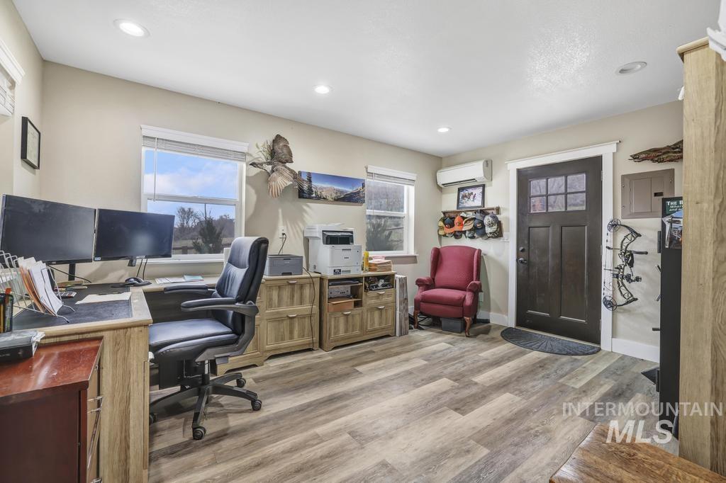1785 River Road Buhl, ID 83316 - Photo 18 of 41 Home office with light wood-style floors, electric panel, and recessed lighting