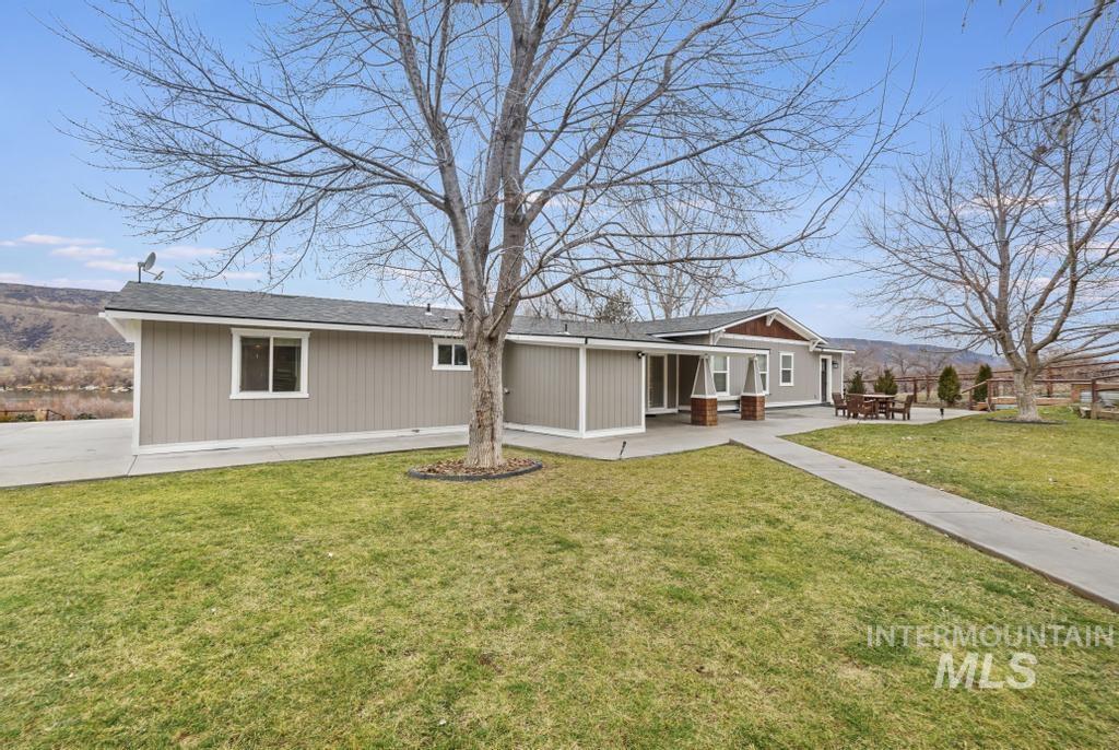 1785 River Road Buhl, ID 83316 - Photo 24 of 41 View of front of house featuring a front lawn and a mountain view