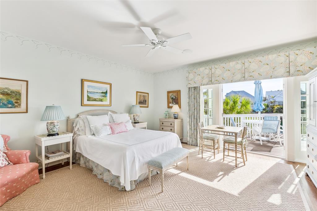 160 Sheep Shank Court Boca Grande, FL 33921 - Photo 12 of 36 a bedroom with a bed a table and chairs