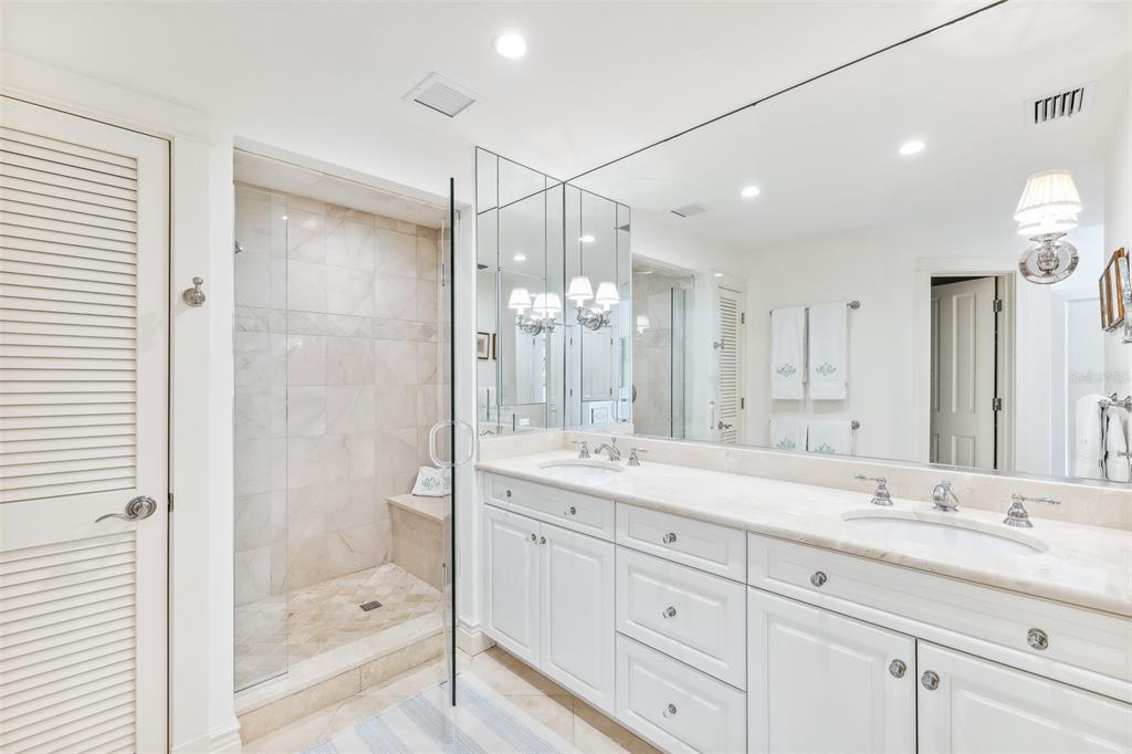 160 Sheep Shank Court Boca Grande, FL 33921 - Photo 14 of 36 a bathroom with a shower sink double and mirror