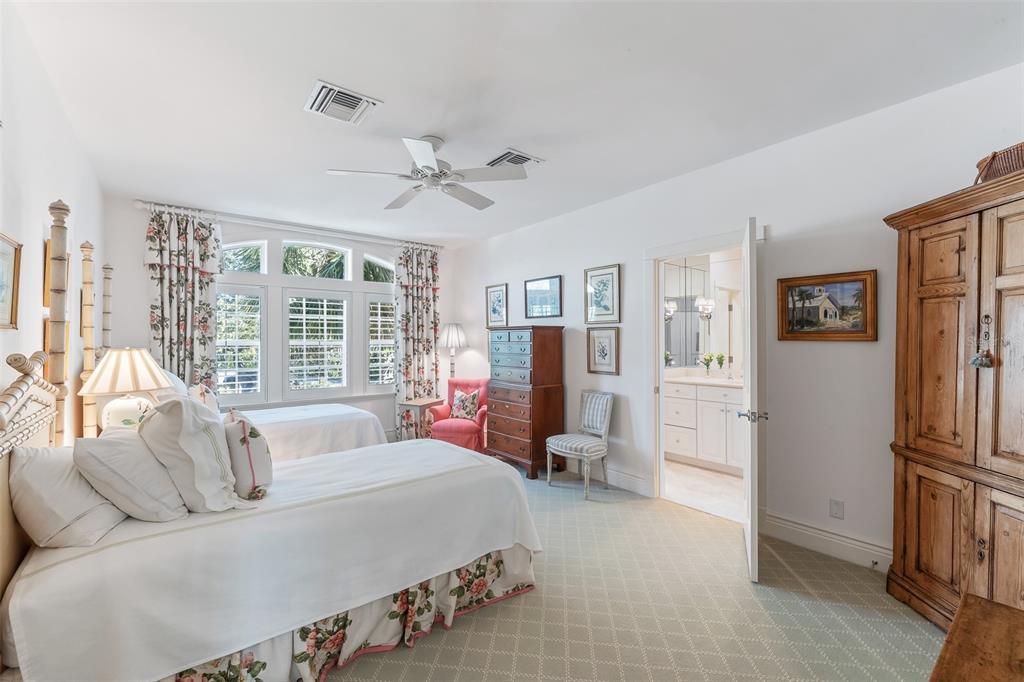 160 Sheep Shank Court Boca Grande, FL 33921 - Photo 20 of 36 a spacious bedroom with a bed couch and a large window