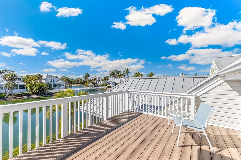160 Sheep Shank Court Boca Grande, FL 33921 - Photo 25 of 36 a view of balcony with wooden floor