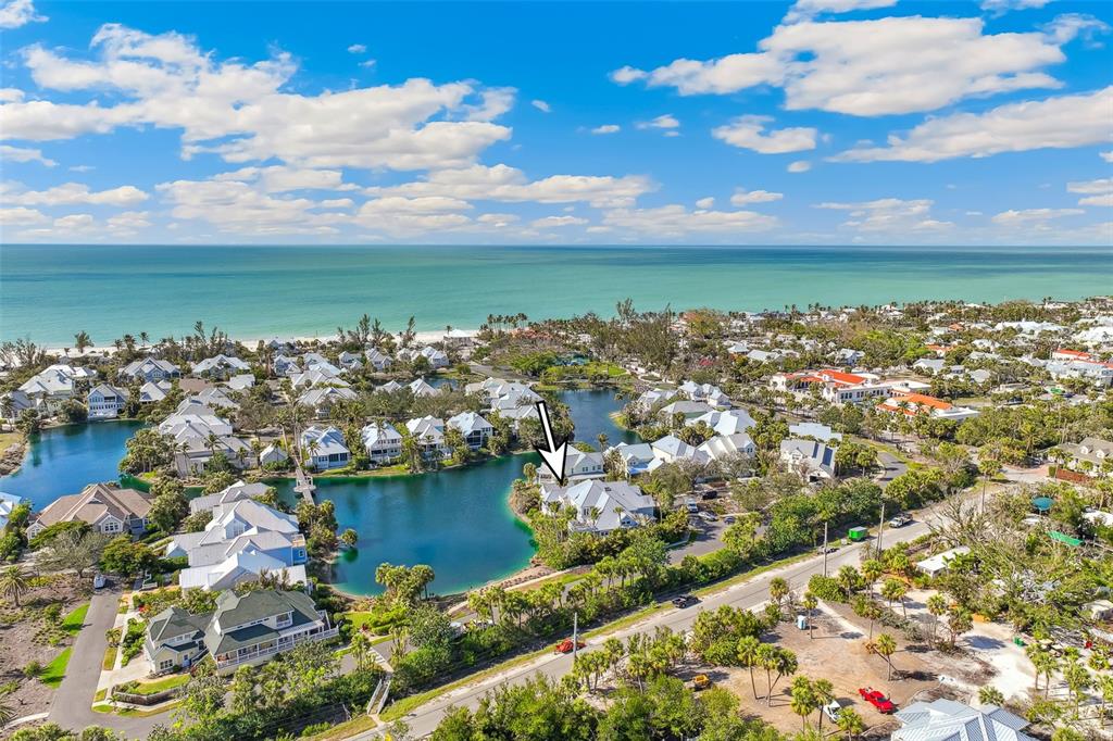 160 Sheep Shank Court Boca Grande, FL 33921 - Photo 31 of 36 a view of a lake with lawn chairs