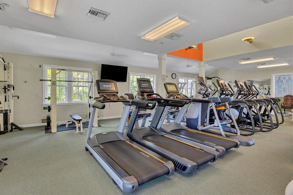160 Sheep Shank Court Boca Grande, FL 33921 - Photo 35 of 36 a room with gym equipment and a large window
