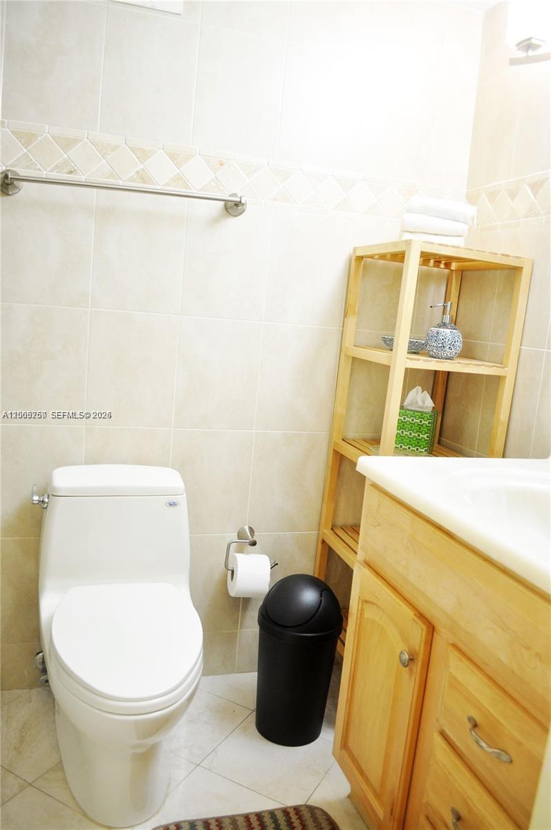 100 Lincoln Road, Unit 534 Miami Beach, FL 33139 - Photo 12 of 15 a white toilet sitting next to a bathroom sink