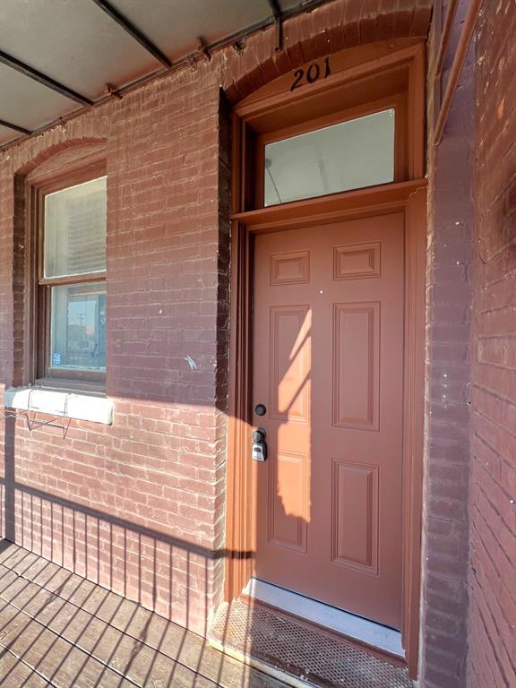 109 Northwest 20th Street, Unit 201 Fort Worth, TX 76164 - Photo 18 of 21 a view of front door of house