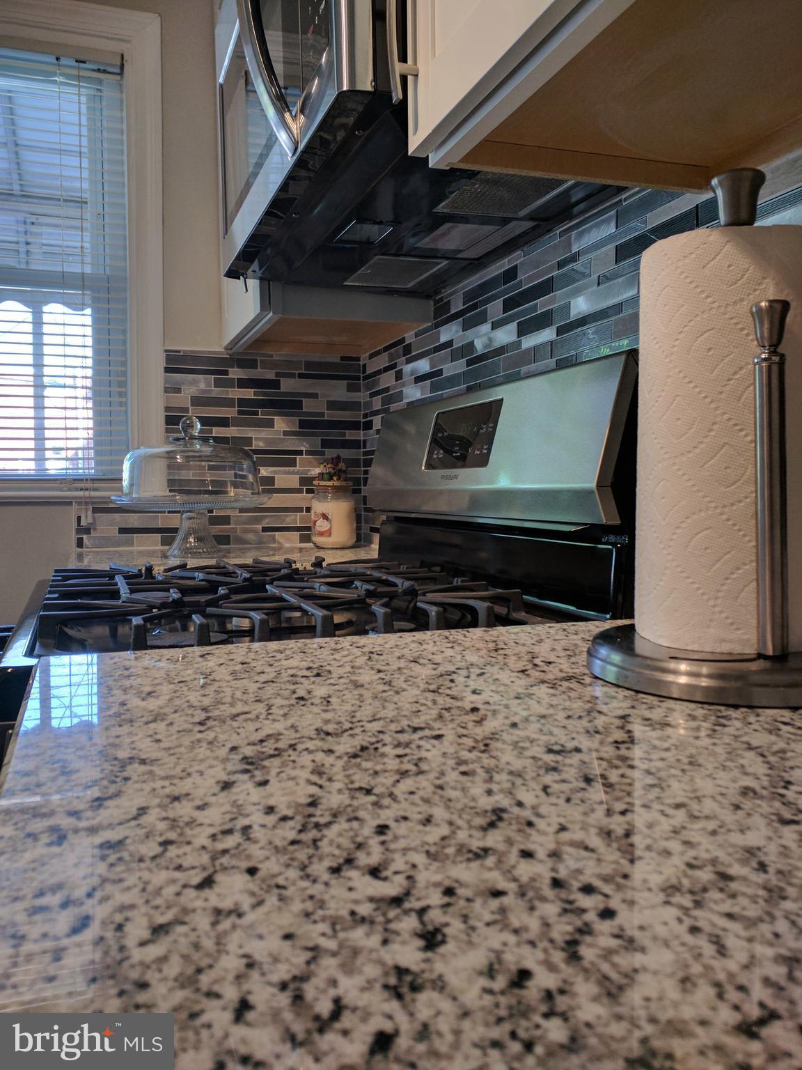 1976 Haselmere Road Dundalk, MD 21222 - Photo 11 of 28 a stove top oven sitting inside of a kitchen