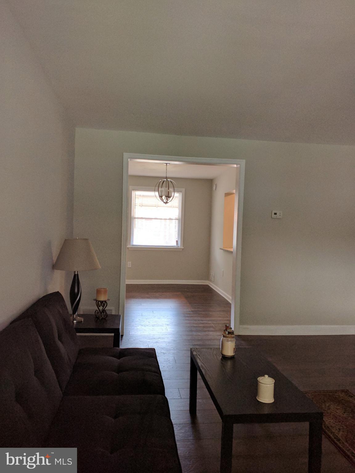 1976 Haselmere Road Dundalk, MD 21222 - Photo 6 of 28 a living room with couches and a flat screen tv