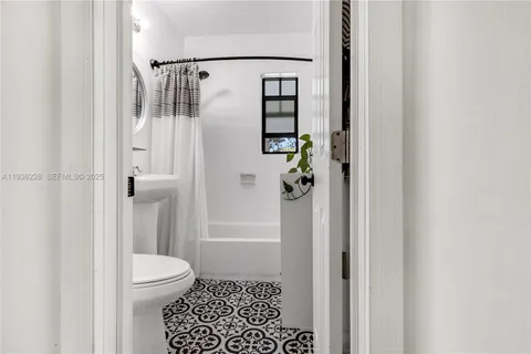 a bathroom with a shower and toilet