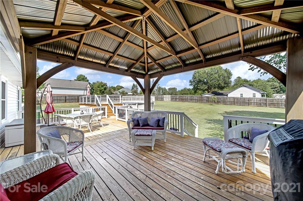 8999 West Meadow Ridge Road Indian Land, SC 29707 - Photo 2 of 28 a view of a swimming pool with a patio