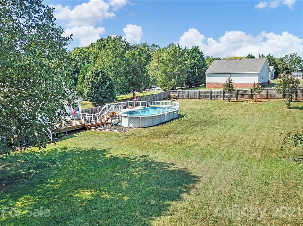 8999 West Meadow Ridge Road Indian Land, SC 29707 - Photo 25 of 28 a view of a house with a backyard and a patio