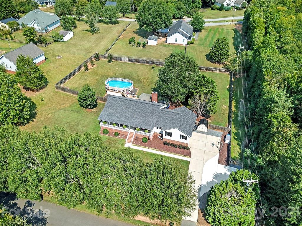 8999 West Meadow Ridge Road Indian Land, SC 29707 - Photo 6 of 28 an aerial view of residential house with outdoor space and trees all around