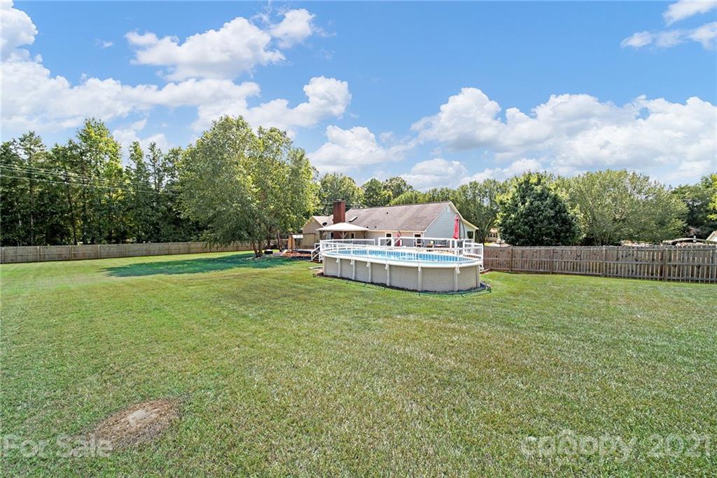 8999 West Meadow Ridge Road Indian Land, SC 29707 - Photo 7 of 28 a view of a house with a big yard and a large trees