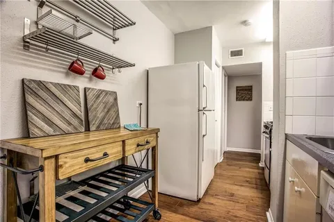 a kitchen with a stove and a microwave