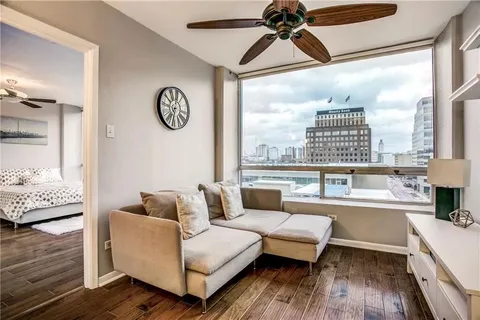 a living room with furniture and a large window