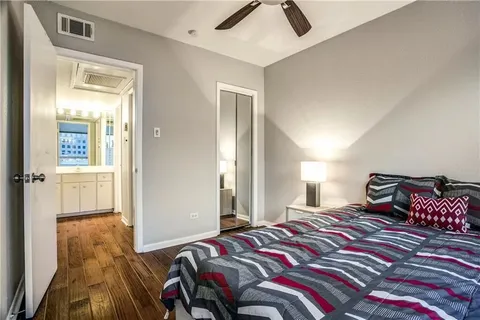 a bathroom with a double vanity sink and mirror