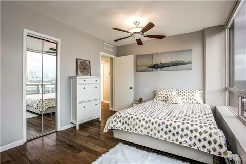 a spacious bathroom with a mirror and a shower