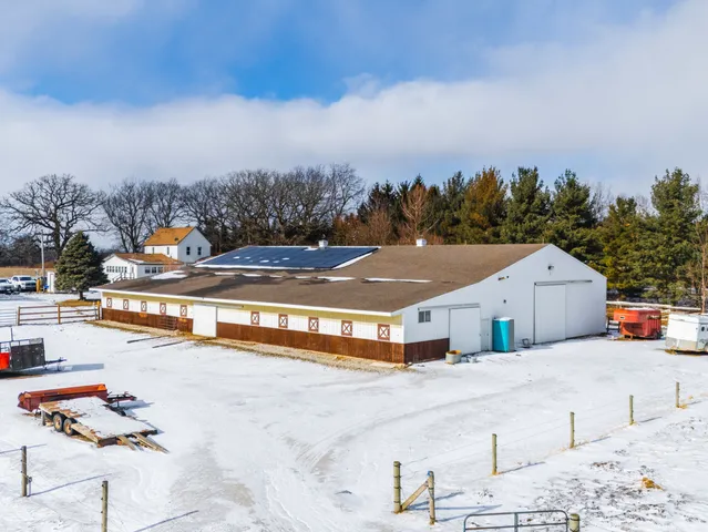 a bedroom with furniture and a chandelier