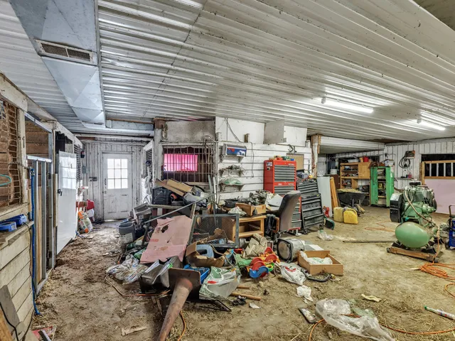 an aerial view of a house with a yard and sitting area