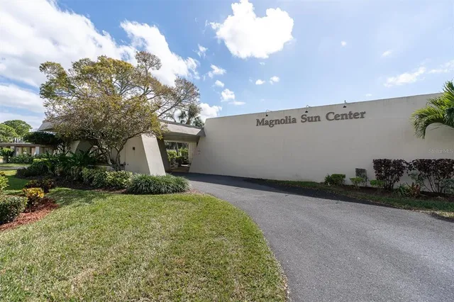 a room with pool table and chairs