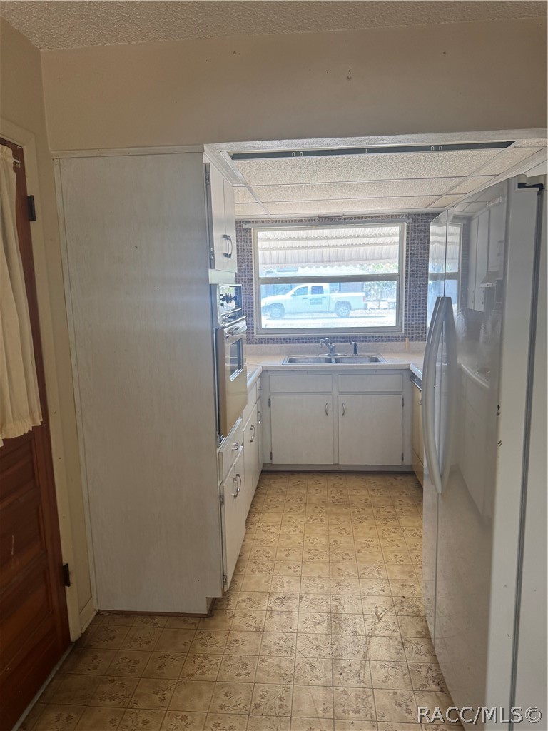 3953 South Fernpark Terrace Inverness, FL 34452 - Photo 6 of 16 a view of walk in closet with window