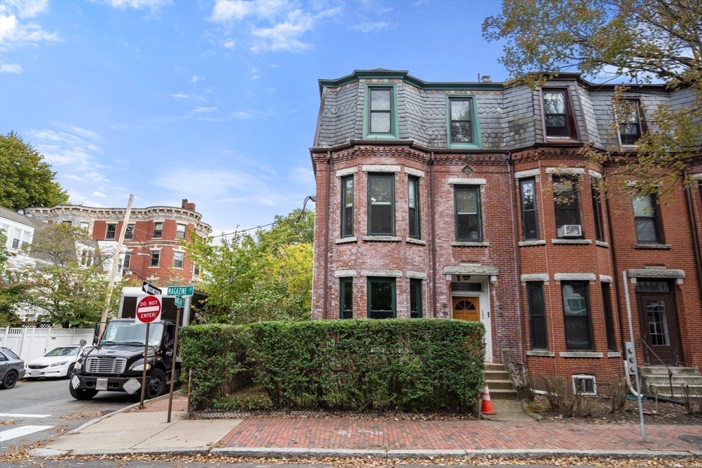 100 Magazine Street, Unit 2 Cambridge, MA 02139 - Photo 12 of 15 a front view of a residential apartment building with a yard