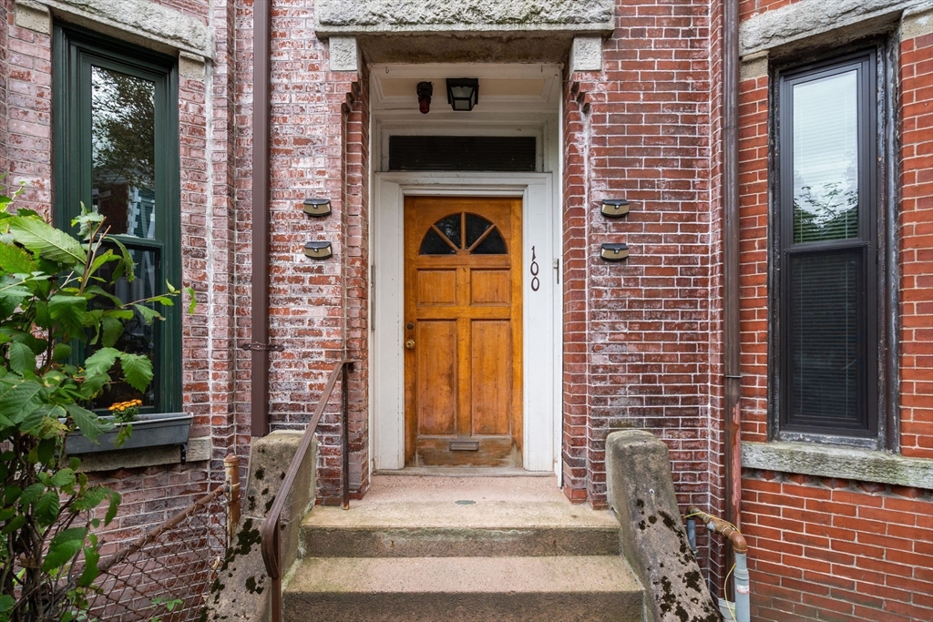 100 Magazine Street, Unit 2 Cambridge, MA 02139 - Photo 14 of 15 a front view of a house with a yard
