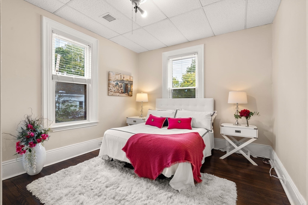 100 Magazine Street, Unit 2 Cambridge, MA 02139 - Photo 7 of 15 a bedroom with a bed and wooden floor