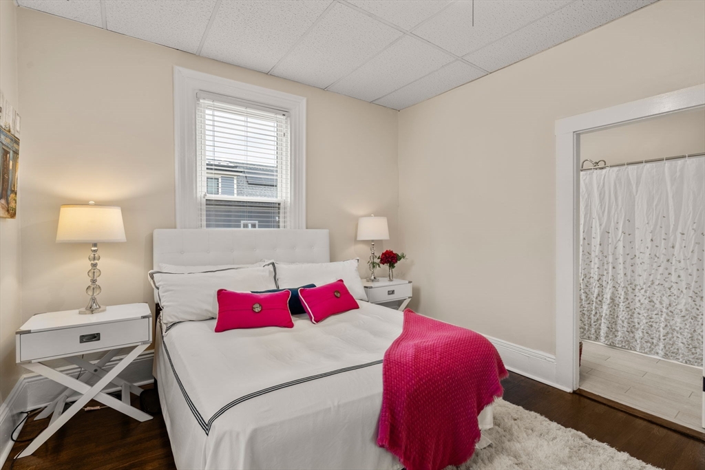 100 Magazine Street, Unit 2 Cambridge, MA 02139 - Photo 8 of 15 a bedroom with a bed and a window