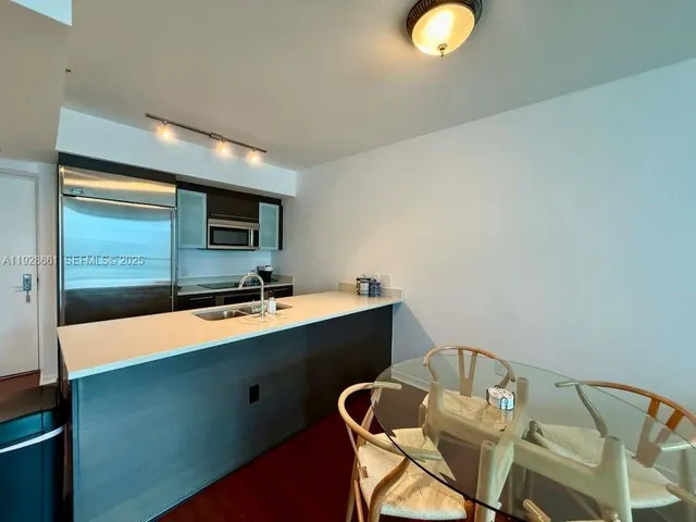 a room with chairs and table