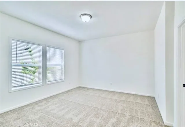 a view of bathroom with sink and mirror
