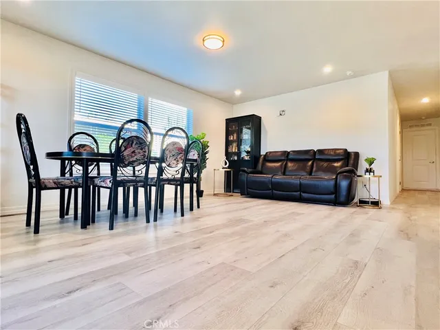 a view of a livingroom with furniture and staircase