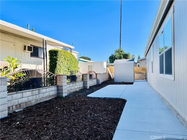 a view of a swimming pool with a yard