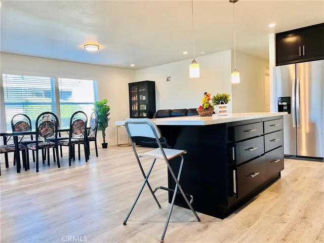 a kitchen with stainless steel appliances a sink and a refrigerator