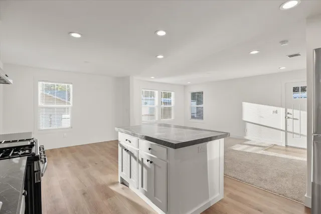 a kitchen that has a lot of cabinets in it