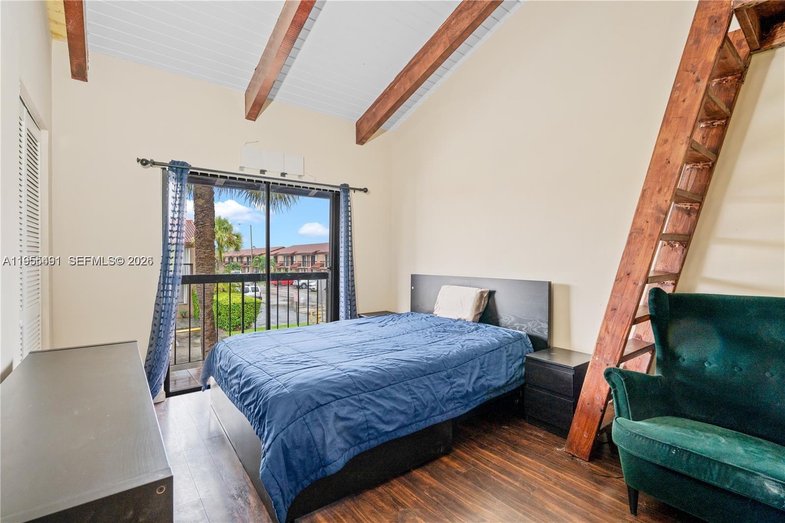 1927 Southwest 107th Avenue, Unit 306 Miami, FL 33165 - Photo 16 of 23 a bedroom with a bed toilet and a window