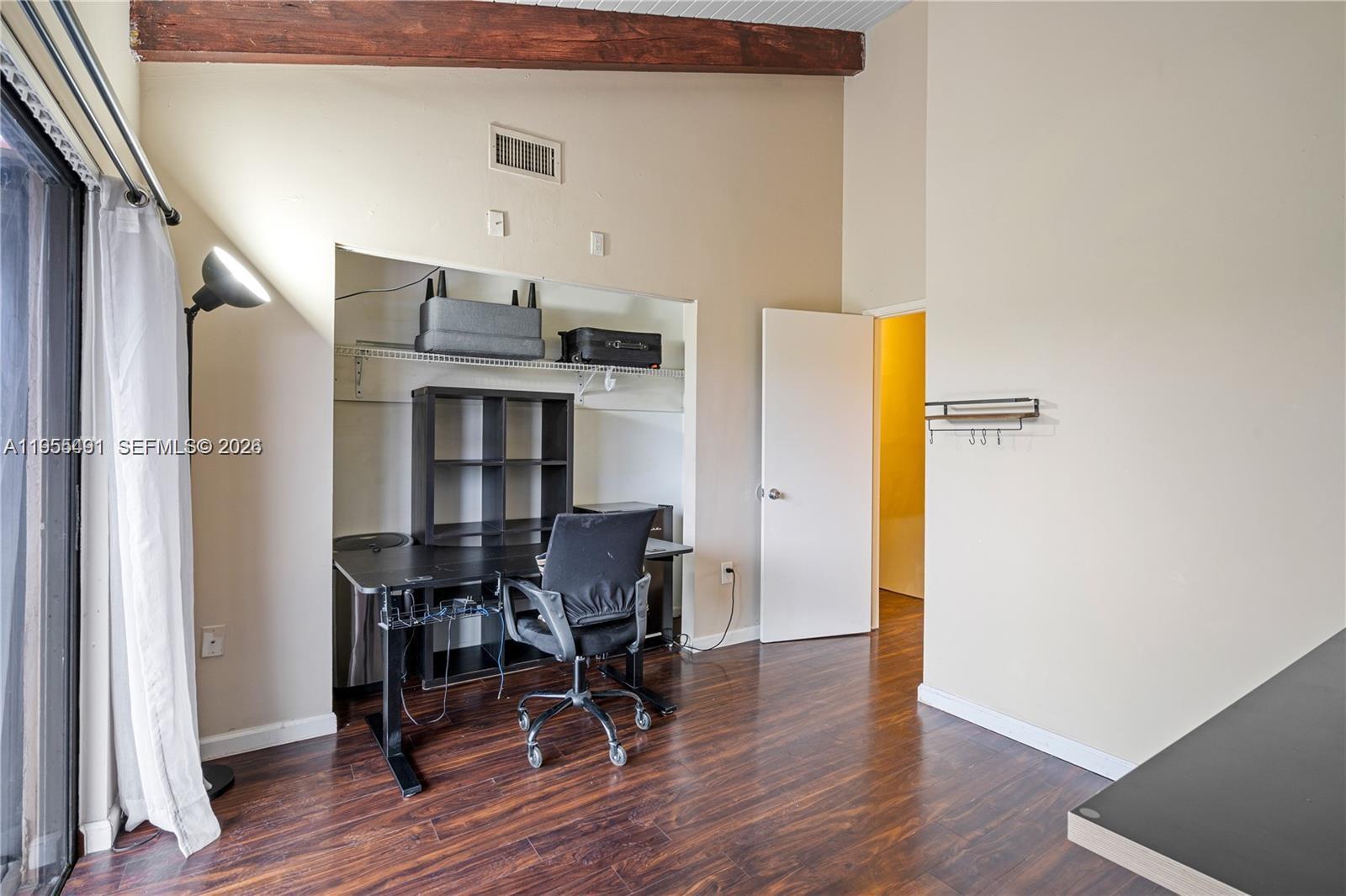 1927 Southwest 107th Avenue, Unit 306 Miami, FL 33165 - Photo 20 of 23 a view of a dining room with furniture and wooden floor