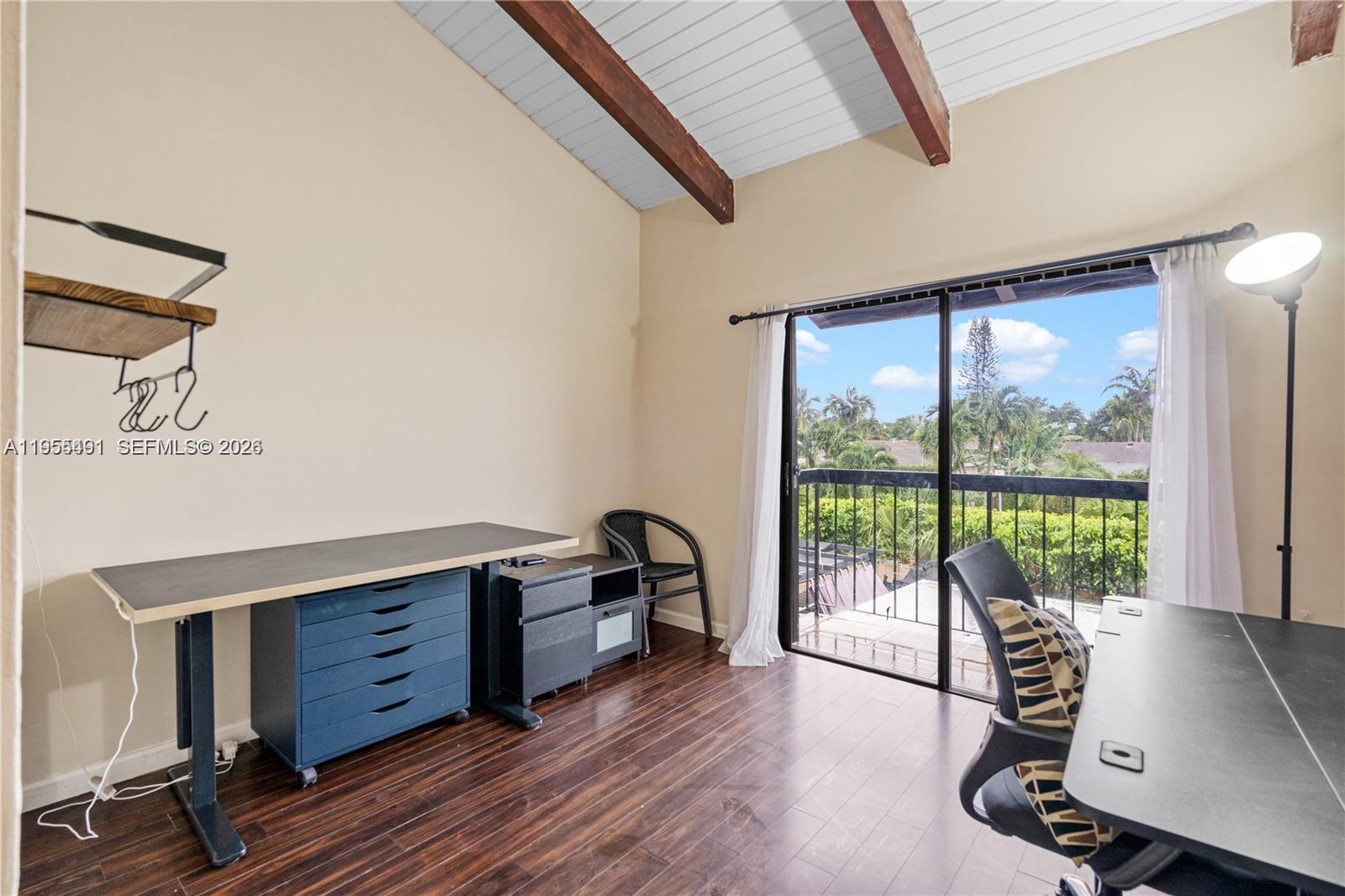 1927 Southwest 107th Avenue, Unit 306 Miami, FL 33165 - Photo 21 of 23 a view of a workspace with furniture and windows